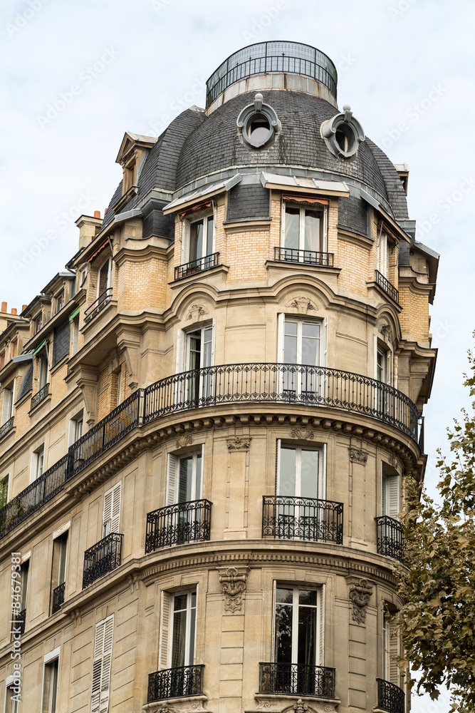 corner of of typical house with balcony in Paris, France