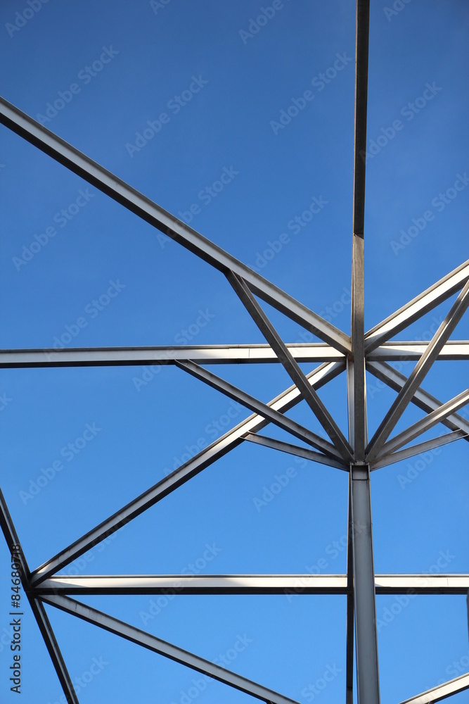 Fototapeta premium Steel roof pillars sky background.