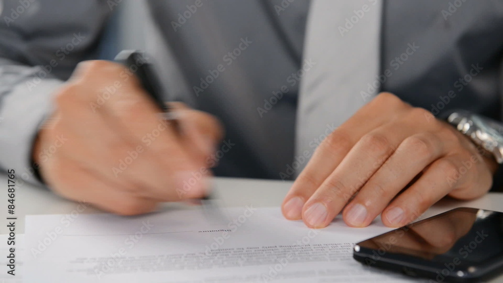 Businessman Signing Document