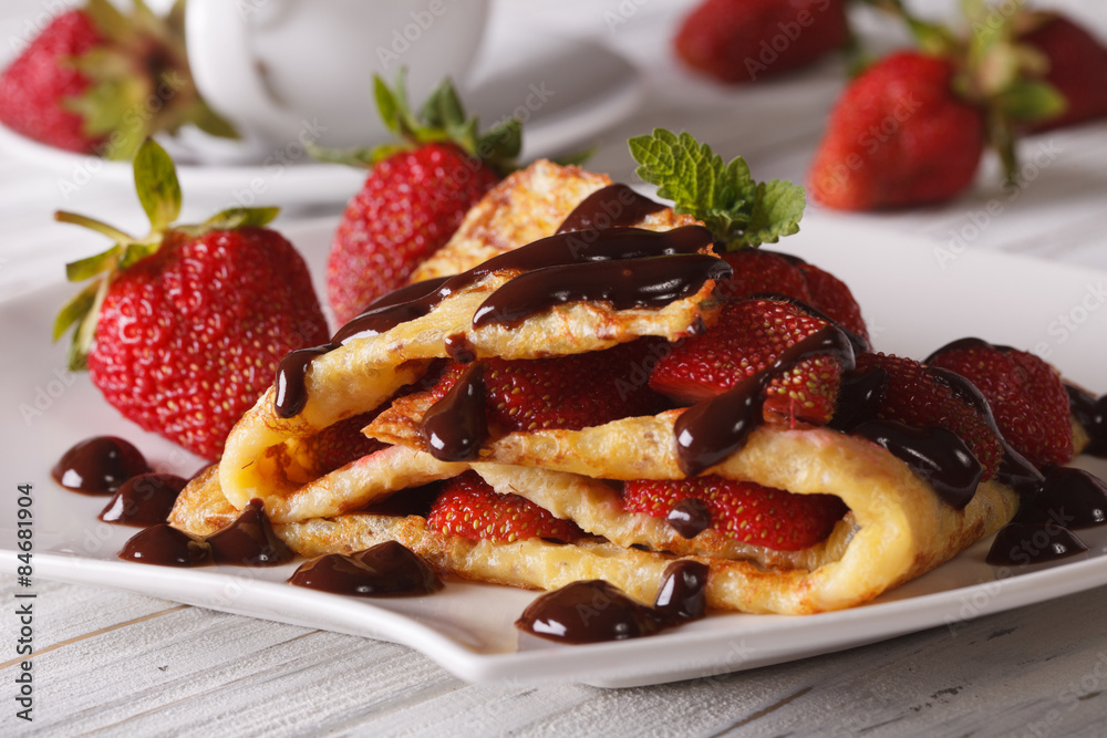 Delicious crepes with fresh strawberries and chocolate Delicious crepes with fresh strawberries and chocolate