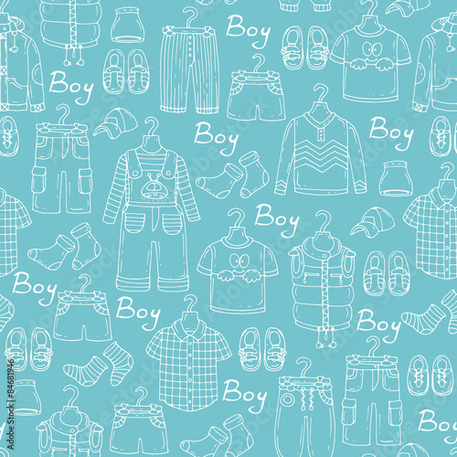 Vector seamless pattern with hand drawn and fashionable clothes for little boys on blue background. Background for use in design, web site, packing, textile, fabric