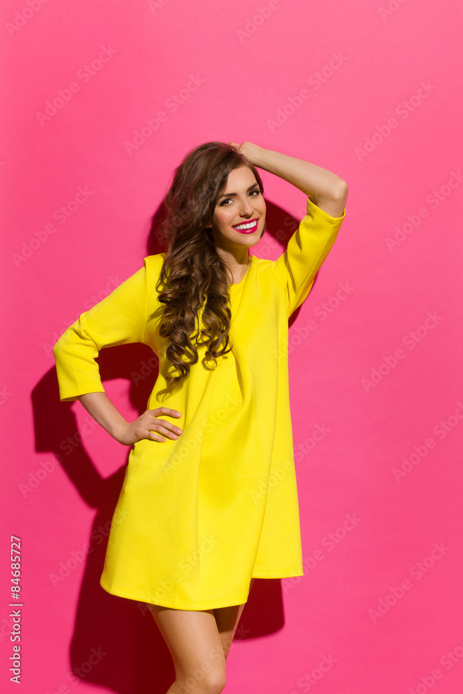 Smiling Beautiful Woman Against Pink Wall Smiling Beautiful Woman Against Pink Wall
