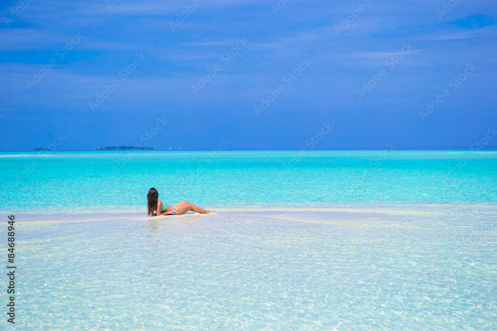 Young happy woman enjoy summer vacation on white sandy beach Young happy woman enjoy summer vacation on white sandy beach