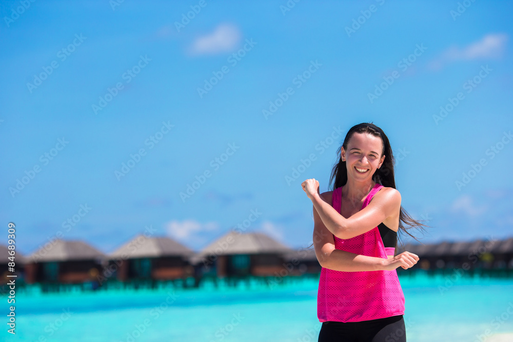 Healthy athlete woman working out doing exercise on tropical Healthy athlete woman working out doing exercise on tropical