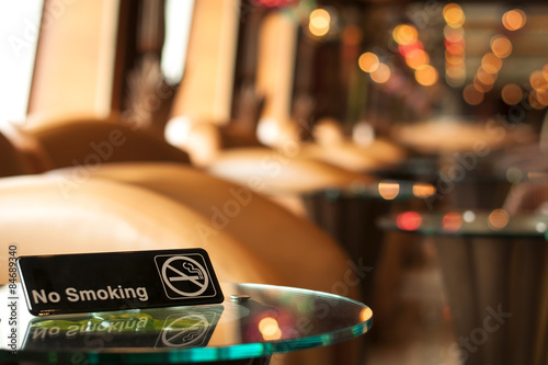 Non smoking sign on a table in a cafe © Victor Moussa