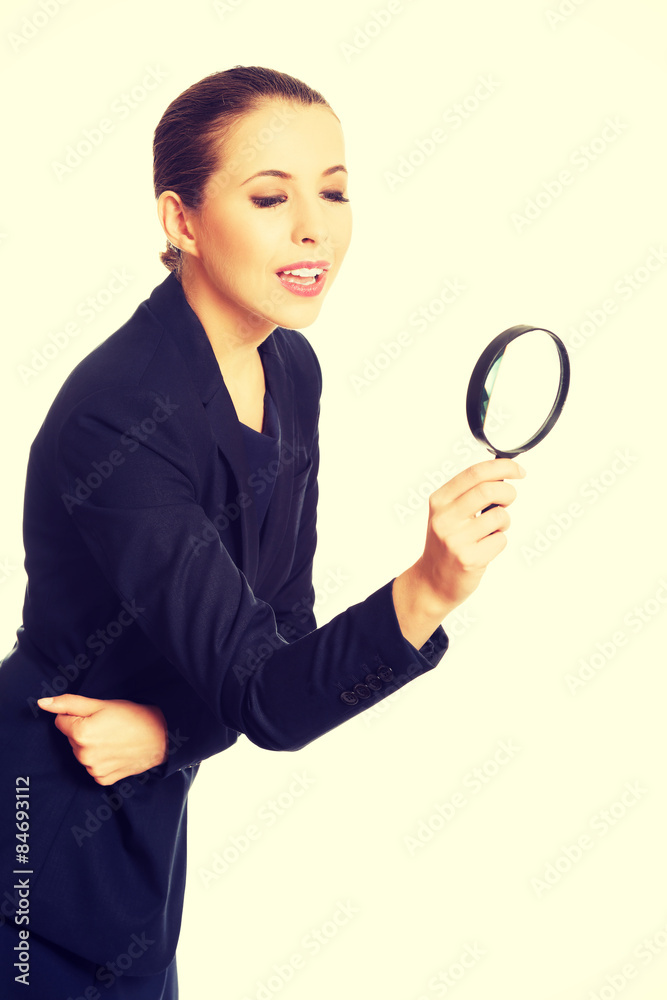Businesswoman with magnifying glass. Businesswoman with magnifying glass.