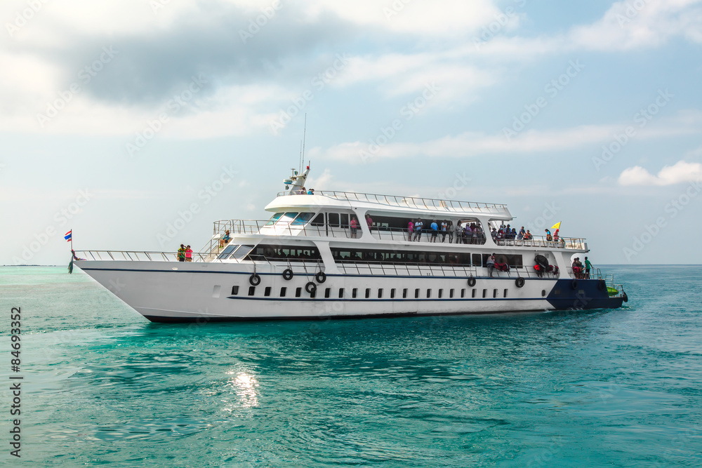 Big white passengers ship on blue tropical sea