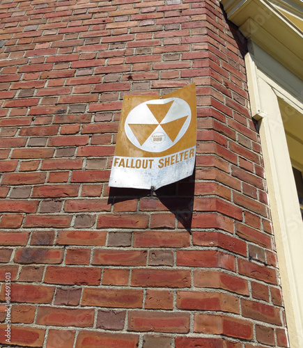Fallout Shelter Sign on Brick Building