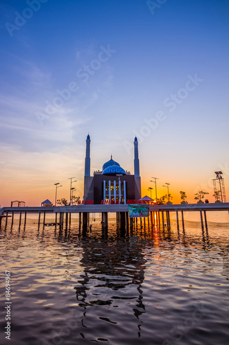 Mosque above the water in Indonesia during sunset