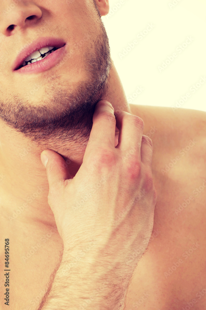 Athletic man feeling pain in his neck. Athletic man feeling pain in his neck.