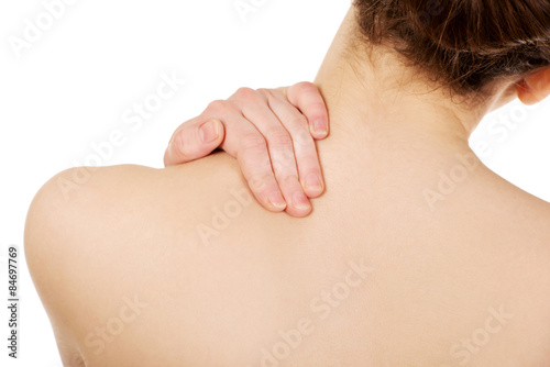 Woman holding her neck.