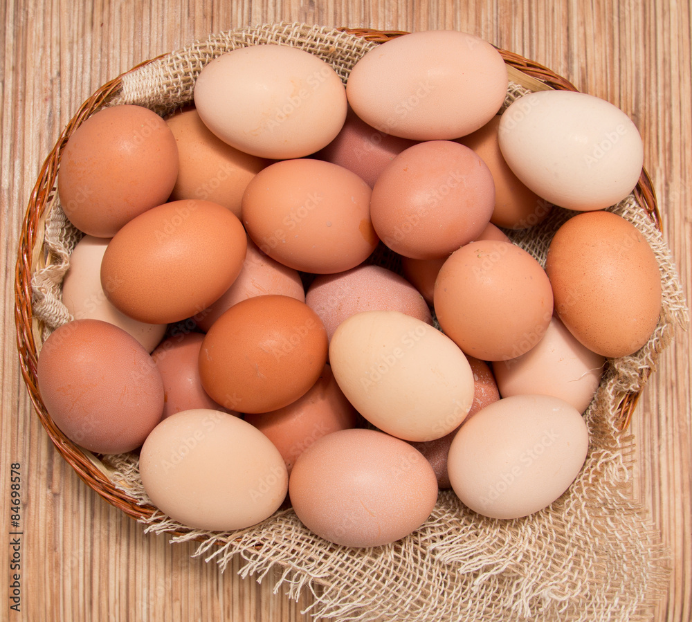 Fresh chicken eggs in a basket Fresh chicken eggs in a basket