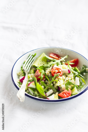 fresh salad with cherry tomatoes, arugula, radish and cucumber