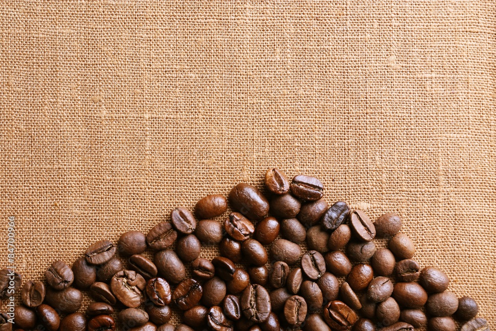Frame of coffee beans on color sackcloth background Frame of coffee beans on color sackcloth background