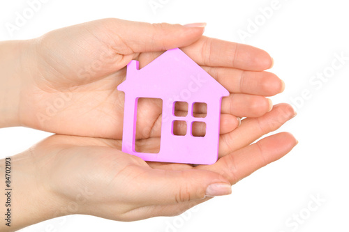 Female hands holding model of house close up