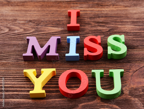 Wallpaper Mural Inscription I MISS YOU made of colorful letters on wooden background Torontodigital.ca