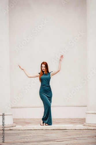 Fototapeta Naklejka Na Ścianę i Meble -  Outdoor portrait of beautiful redhead young woman