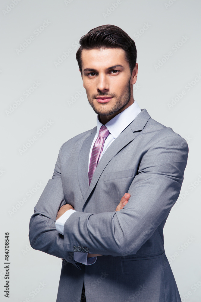 Confident businessman with arms folded Confident businessman with arms folded