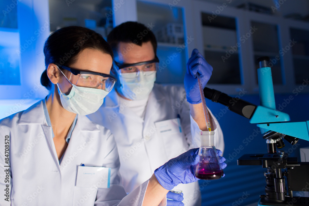 close up of scientists making test in lab close up of scientists making test in lab