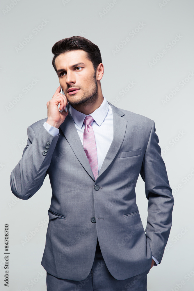 Serious businessman talking on the phone Serious businessman talking on the phone