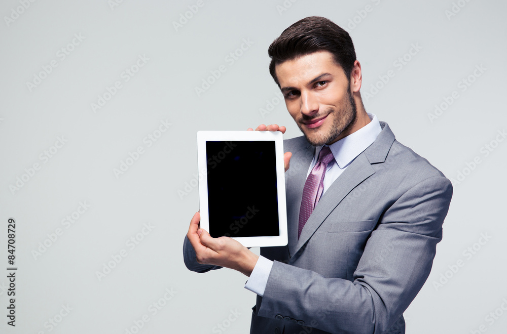 Businessman showing tablet computer screen Businessman showing tablet computer screen