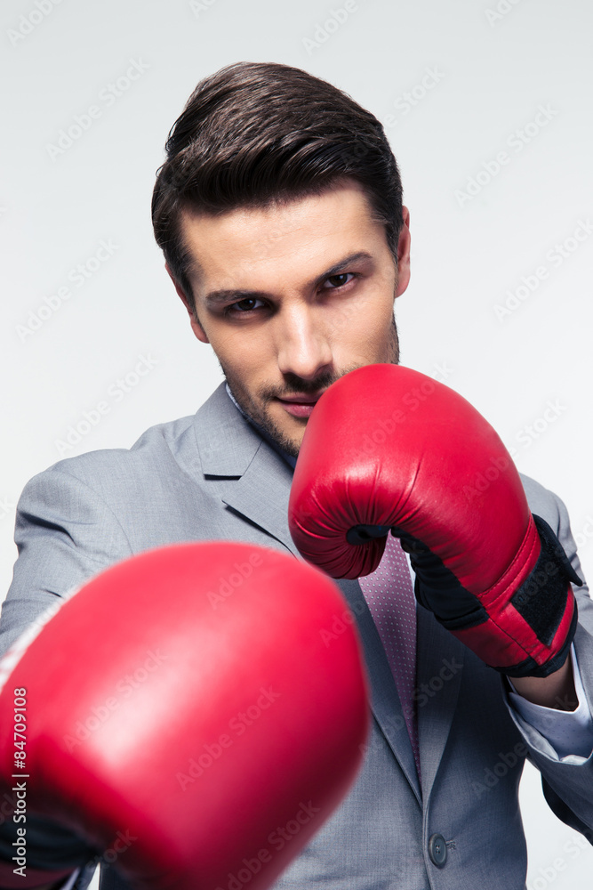 Businessman ready to fight with boxing gloves Businessman ready to fight with boxing gloves
