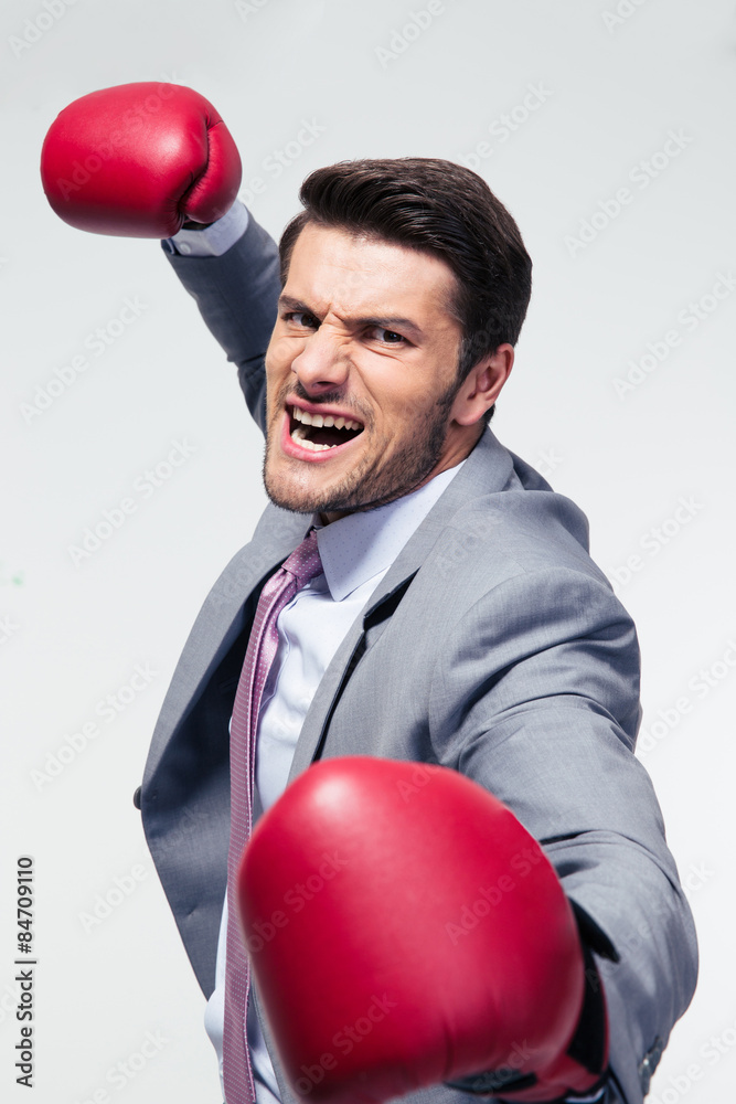 Angry businessman with boxing gloves Angry businessman with boxing gloves