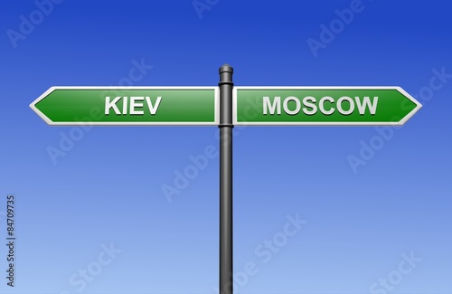 Signpost with arrows pointing two directions - towards Kiev and Moscow.