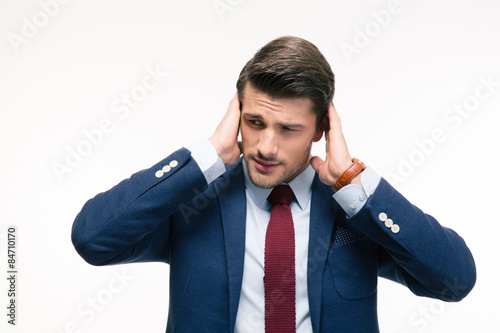 Handsome businessman covering his ears