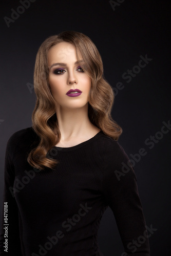 Portrait of young girl with makeup and retouch on dark backgroun