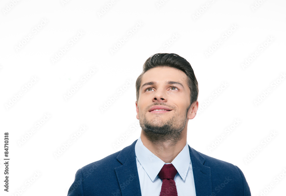 Happy thoughtful businessman looking up Happy thoughtful businessman looking up