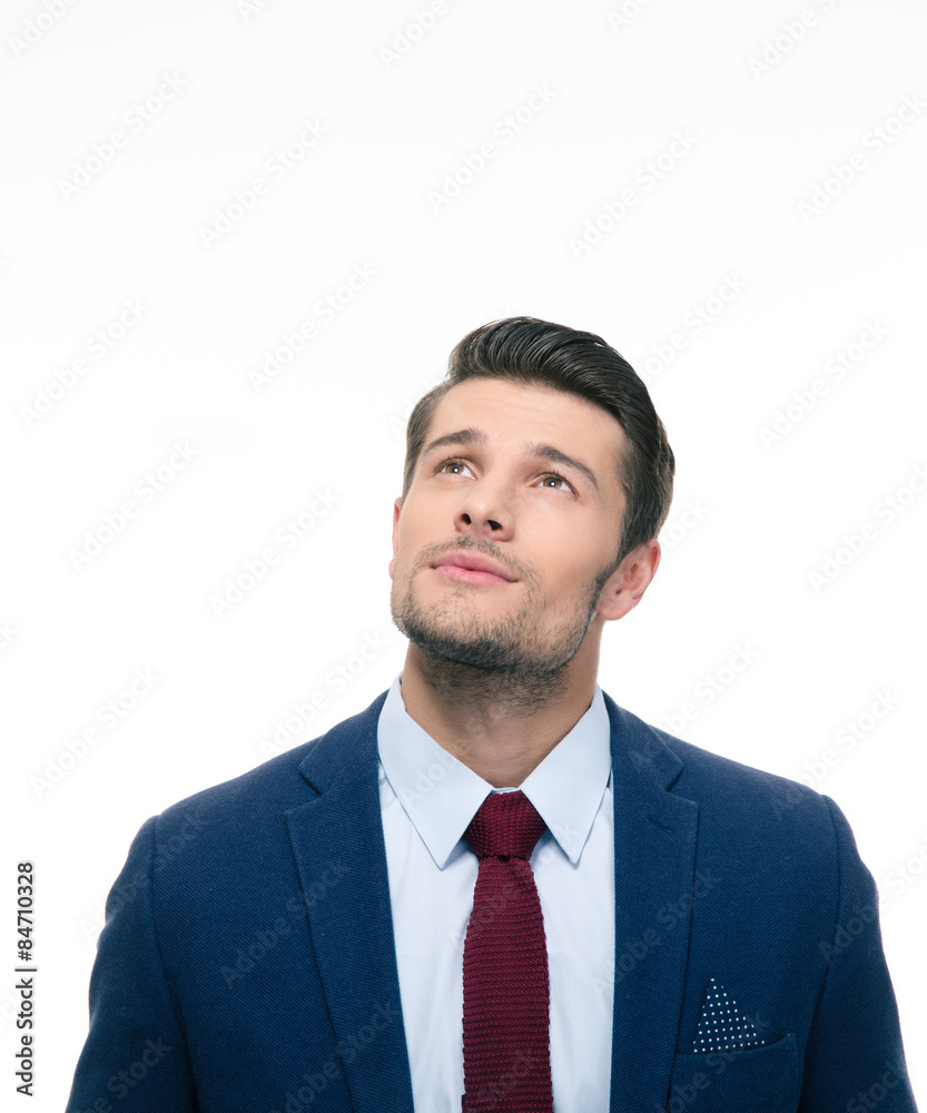 Pensive businessman looking up at copyspace Pensive businessman looking up at copyspace
