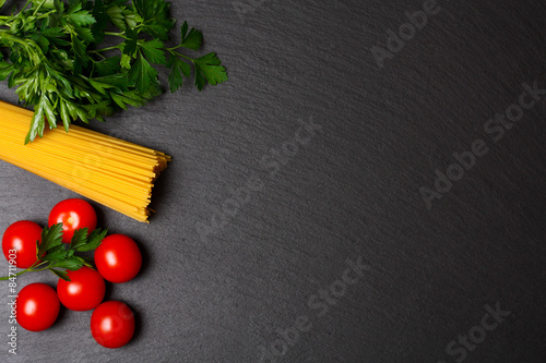 Raw pasta with tomatoes and parsley