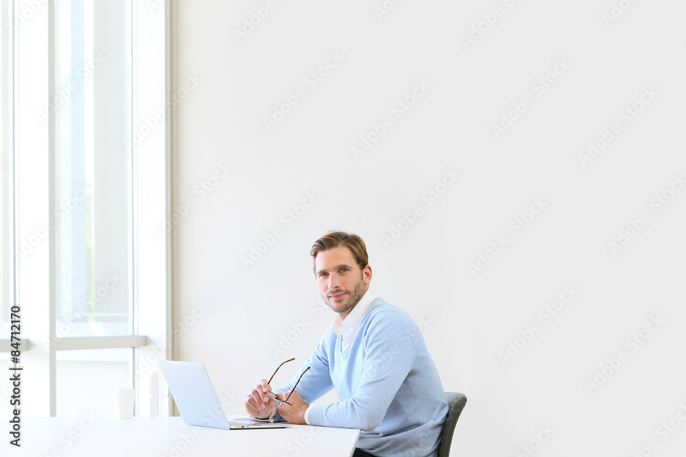 businessman in modern office working on laptop businessman in modern office working on laptop
