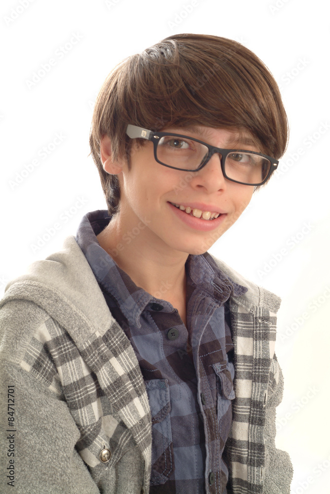 Teenage boy with cap and glasses on a white background