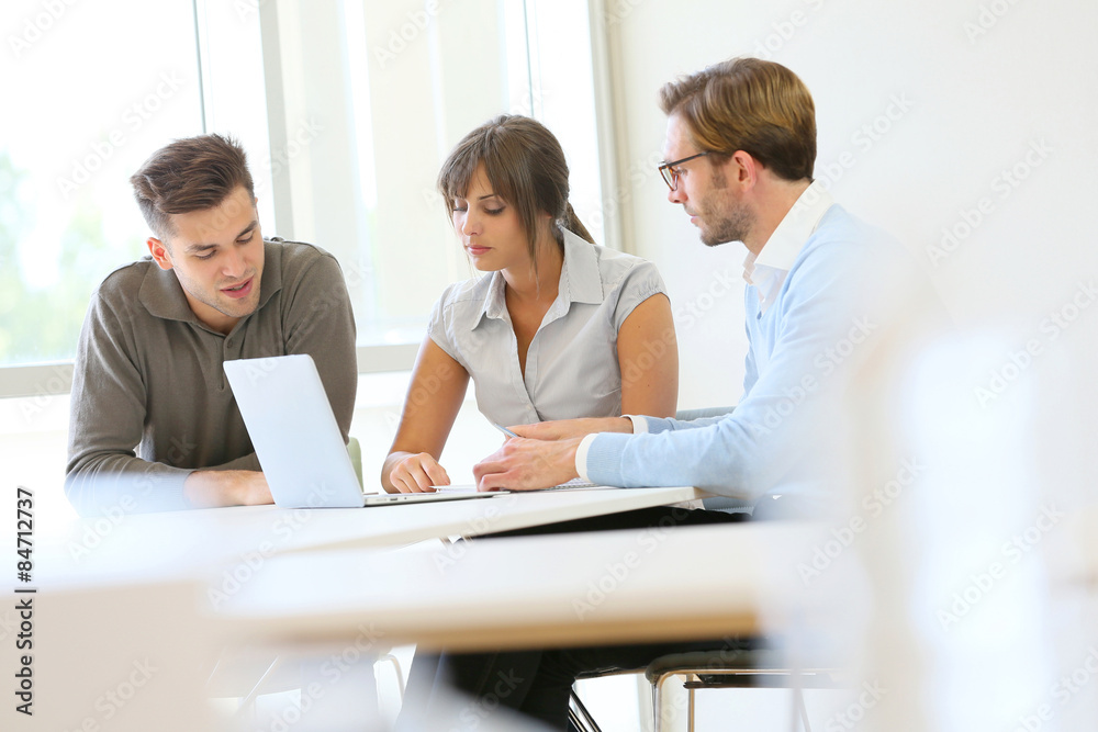 Business people working together in meeting room Business people working together in meeting room