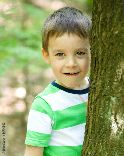Boy is playing in the wood