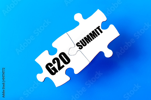 Connected puzzle pieces with words G20 and SUMMIT photo