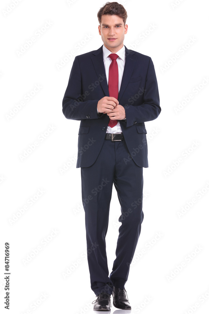 young business man walking on isolated background.