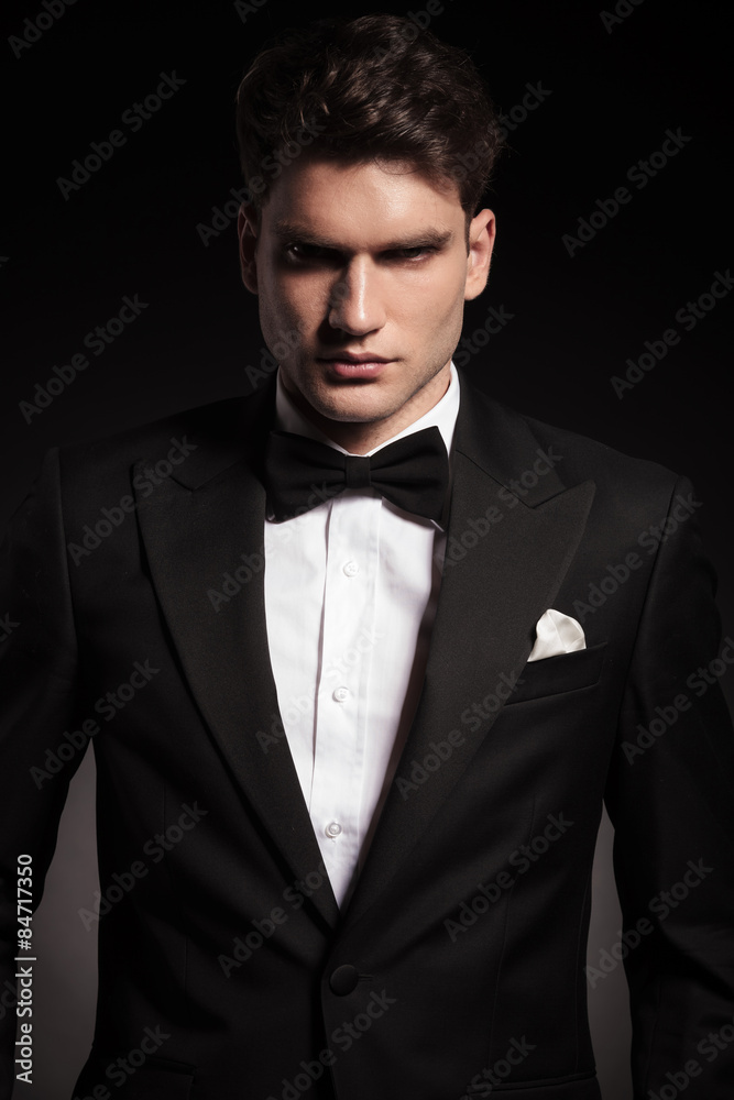 elegant man wearing a black tux. elegant man wearing a black tux.