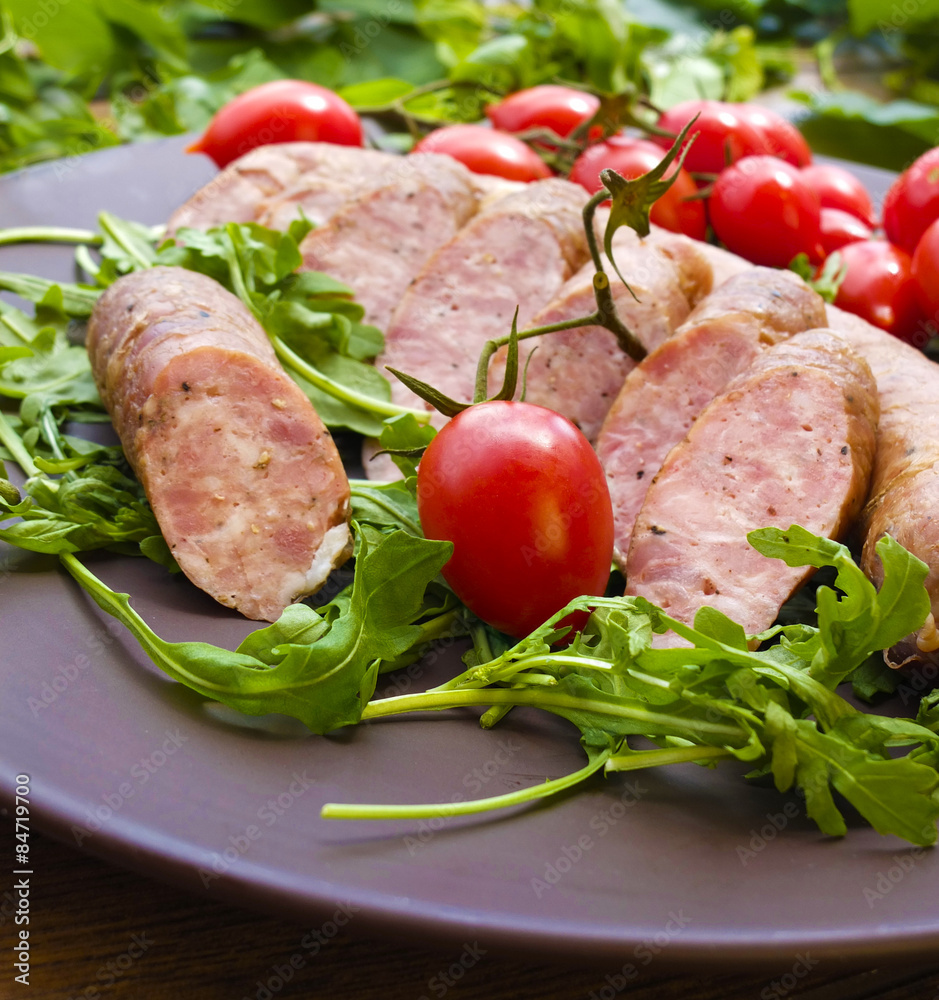 Smoked sausages with greens, cherry tomatoes Smoked sausages with greens, cherry tomatoes