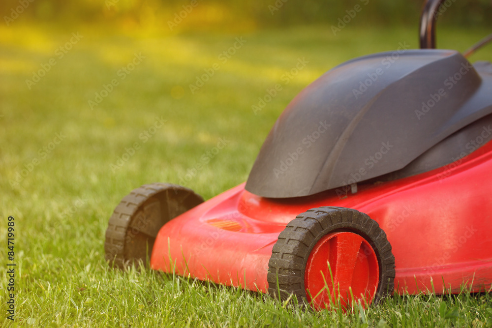 Lawn mower on green grass Lawn mower on green grass