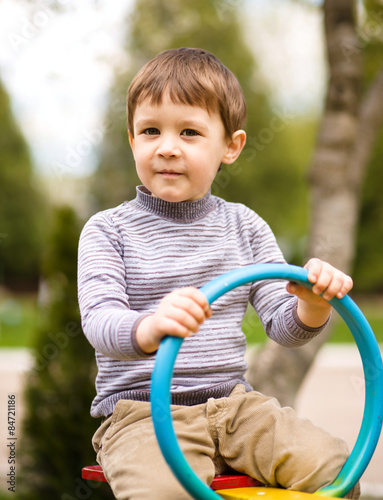 Little boy is playing on playground