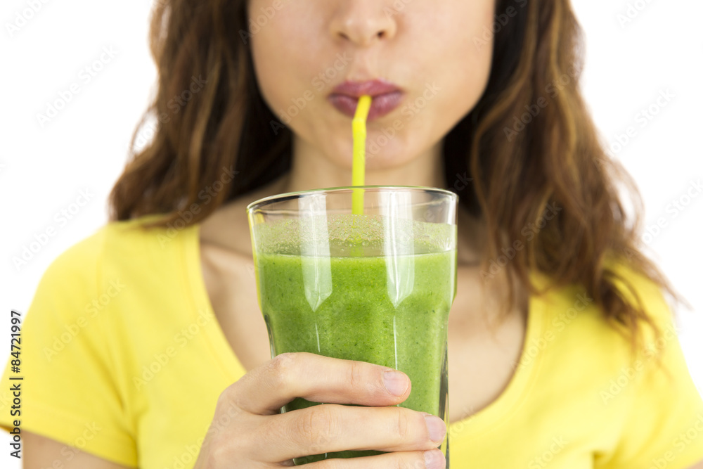 Close up of woman drinking green vegetable smoothie Close up of woman drinking green vegetable smoothie