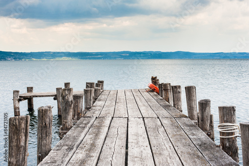 Fototapeta Lake jetty in autumn day