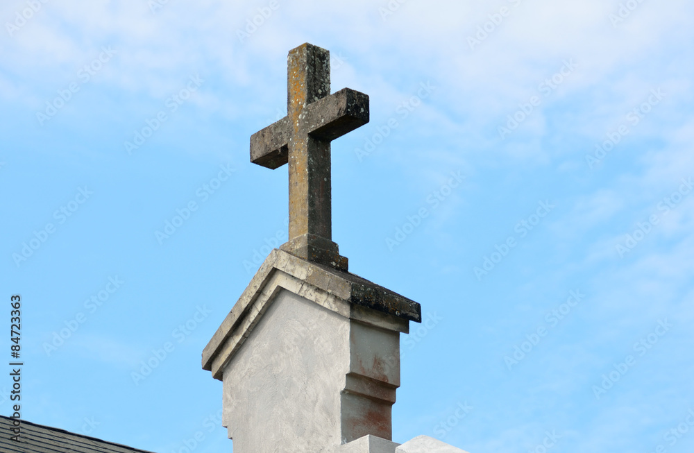 Old Cross on top of church roof top