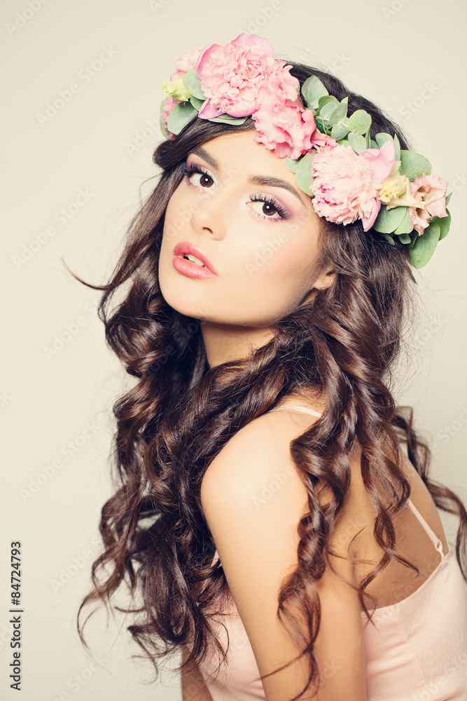 Beautiful Young Woman with Summer Pink Pione Flowers. Long Curly
