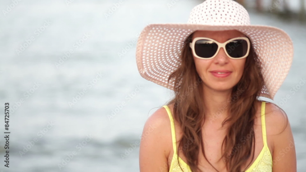 beautiful woman in sunglasses and big hat enjoying on sea beautiful woman in sunglasses and big hat enjoying on sea