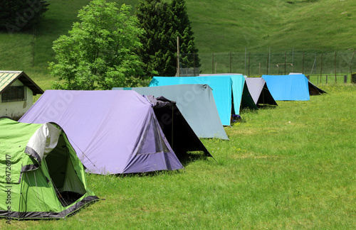 long row of tents to sleep during the summer camp © ChiccoDodiFC