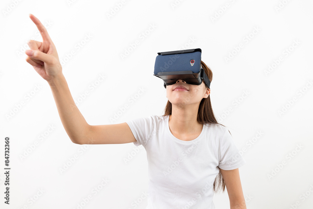 Woman wear with with VR device and finger touch in air Woman wear with with VR device and finger touch in air